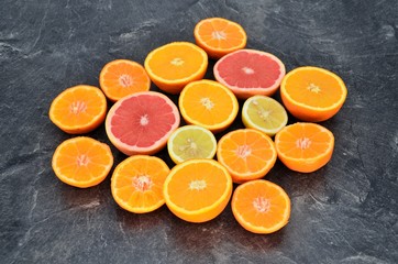 orange lemon fruits slices on table