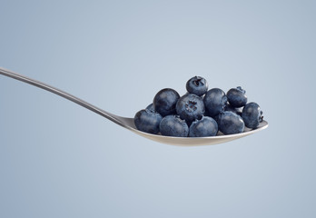 Spoon with blueberries