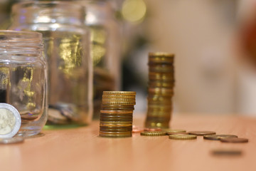 Euro coin stacked on each other. Concept of saving. Money In a glass jar