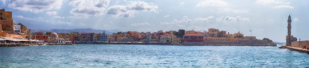 Fototapeta na wymiar Travel Concepts and ideas. Panoramic Image of Chania Old City and Ancient Venetian Port Taken From Lighthouse Pier in Crete, Greece.