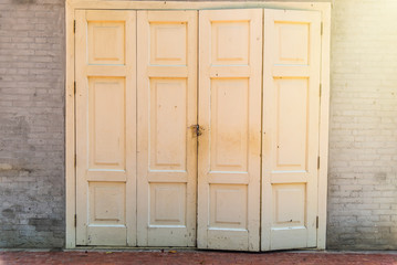Old wooden door with cement.Thailand.
