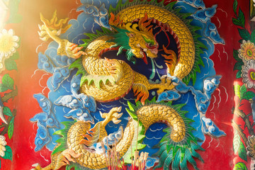 Chinese style dragon sculptures on the temple walls.Bangkok.Thailand.