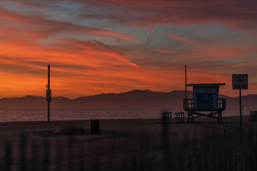 Fototapeta na wymiar Baywatch station on beach at sunset