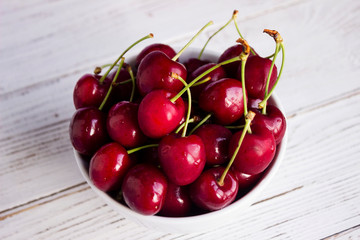 Ripe cherry berries in two white plates, fruit, background