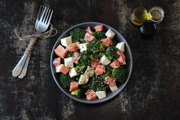 Poke bowl with salmon and broccoli.