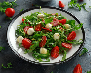 Chorizo salad with cherry tomatoes, mozzarella and wild rucola