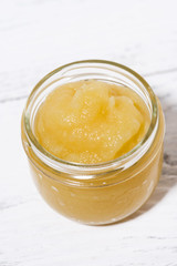 Obraz na płótnie Canvas apple sauce in a glass jar, top view