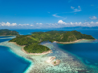 Aerial view of tropical island Tampel. Beautiful tropical island with sand beach, palm trees. Travel tropical concept. Palawan, Philippines