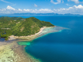 Fototapeta na wymiar Aerial view of tropical island Tampel. Beautiful tropical island with sand beach, palm trees. Travel tropical concept. Palawan, Philippines