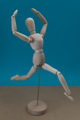 Wooden mannequin. Happiness and dancing concept.