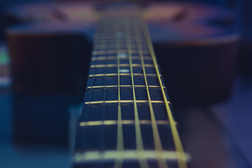 Guitar neck, strings, frets.