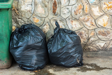 Trash bags and trashcan, Garbage bags awaiting transport.Thailand.