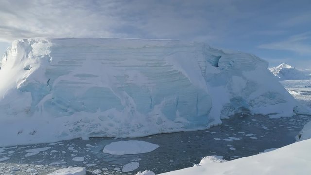 Antarctica Tabular Iceberg Aerial Drone View. Climate Change. Antarctic Continent Expedition in Ocean Glacier Water. Extreme Seascape. Global Warming Concept Top Flight Footage Shot in 4K (UHD)