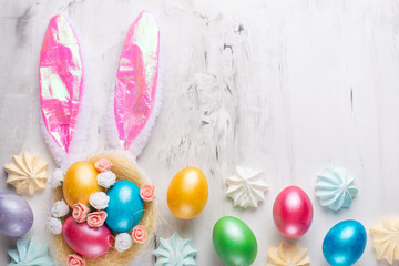 Easter eggs with bunny ears on a marble background. Lay lay with space for design. Horizontal...