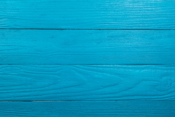 Wooden background of light blue color by close up.
