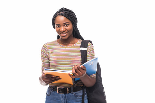 African American student girl holding books isolated on white background.