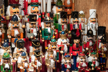 Display of nutcracker soldiers and decorations on sale at Christmas market stall