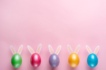Easter eggs with rabbit ears. Flat lay. View from above