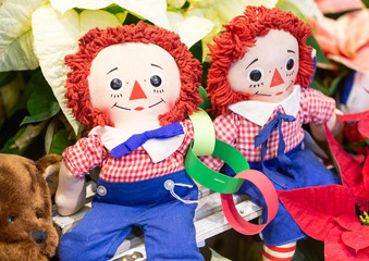 Dolls under vintage Christmas tree