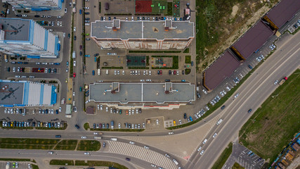 Top down view of buildings, street roads with cars in Krasnodar city, Russia