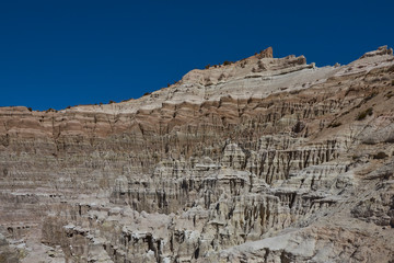 Fototapeta premium Eroded rock formations along Quebrada Chuba, a river valley high on the Altiplano of northern Chile in Lauca National Park.