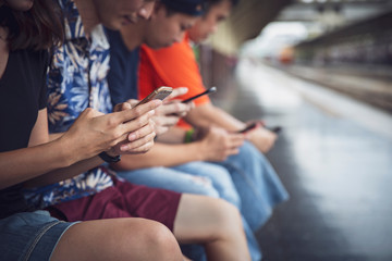 Group of friends using digital smartphones outdoor with having fun with technology trends , Teen lifestyle social media concept