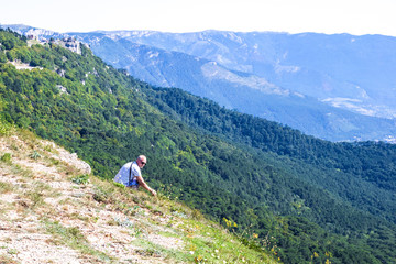 man sitting on a mountain