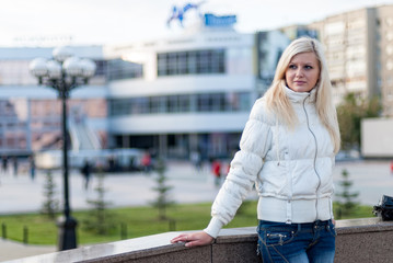 Blond woman over urban background