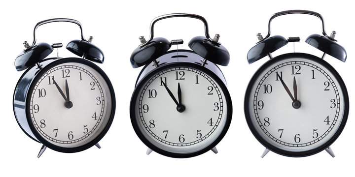 Black alarm clocks isolated on white background