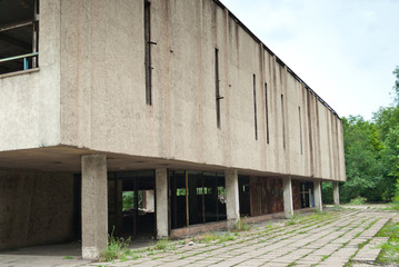 Fototapeta na wymiar Abandoned factory building, ruins, broken windows, rust, unfinished