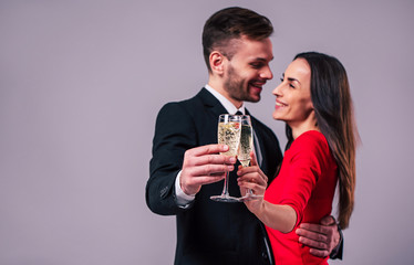 Together forever with love. Elegant stylish happy couple with champagne in hands