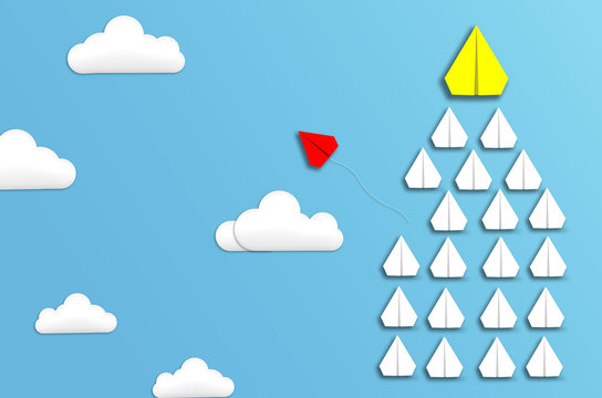 leadership concept creative paradoxical ideas red airplane flying change from yellow leader and team in sky to the best target successful. group of plane fly follow up the leader to win successful.