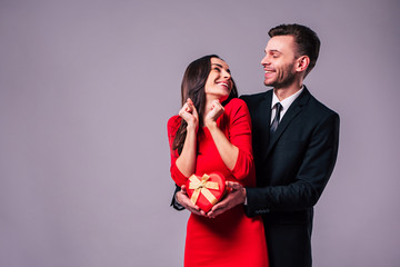 Love forever. Excited and happy couple in love are hugging, kissing and celebrating the St...
