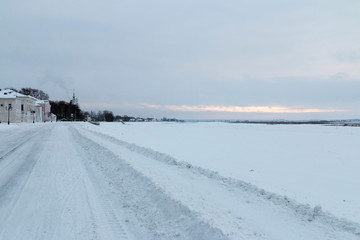 Winter landscape: embankment of the river Sukhona in Veliky Ustyug in the snow in winter