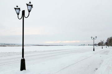 Embankment of the river Sukhona in Veliky Ustyug in the snow in winter