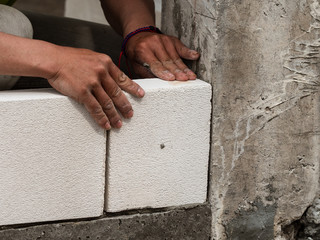 bricklayer installing bricks