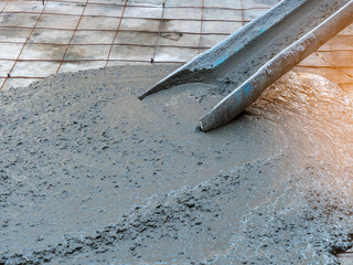 concrete mixing from truck pouring on floor in construction site
