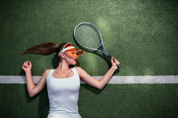 Zelfklevend Fotobehang Beautiful girl playing tennis outdoors © AboutLife