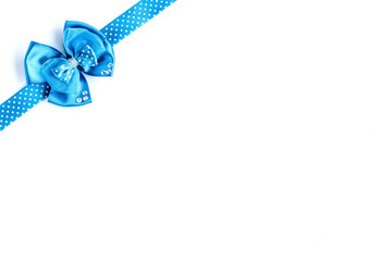 Blue ribbon bow isolated on white background.