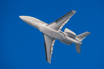 White modern private business jet in the flight