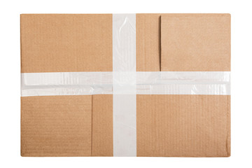 Cardboard box with white sticky tape isolated on white background. Top view. Flat lay