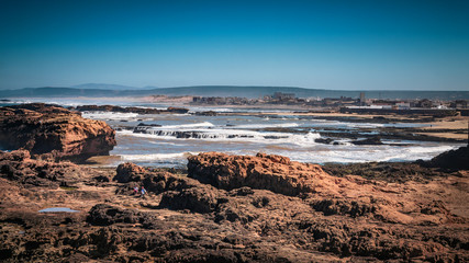 Ocean waves coming to shore Rocky coastline of the Essaouira, Morocco. Beautiful seascape