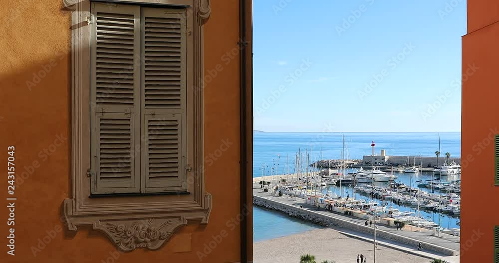 Sticker beautiful window decorated picturesque in the old town of menton, the port is in the background, fre