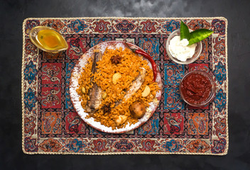 Arabic dish of rice and fried fish. Fish Kabsa.
