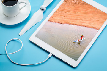 stand up paddler on a  lake