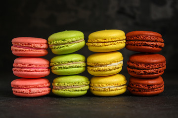 macaron or macaroon cake, colorful cookies (dark background). copy space