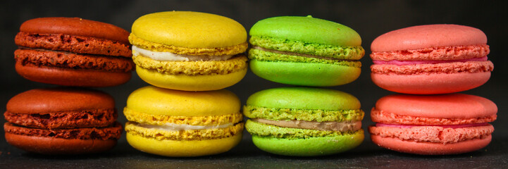 macaron or macaroon cake, colorful cookies (dark background). copy space
