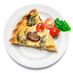 Slice of traditonal homemade spinach chicken quiche tart or pie on plate