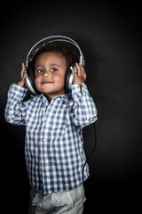 Little boy listens music