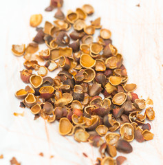 lot of pine nut peel on a white background